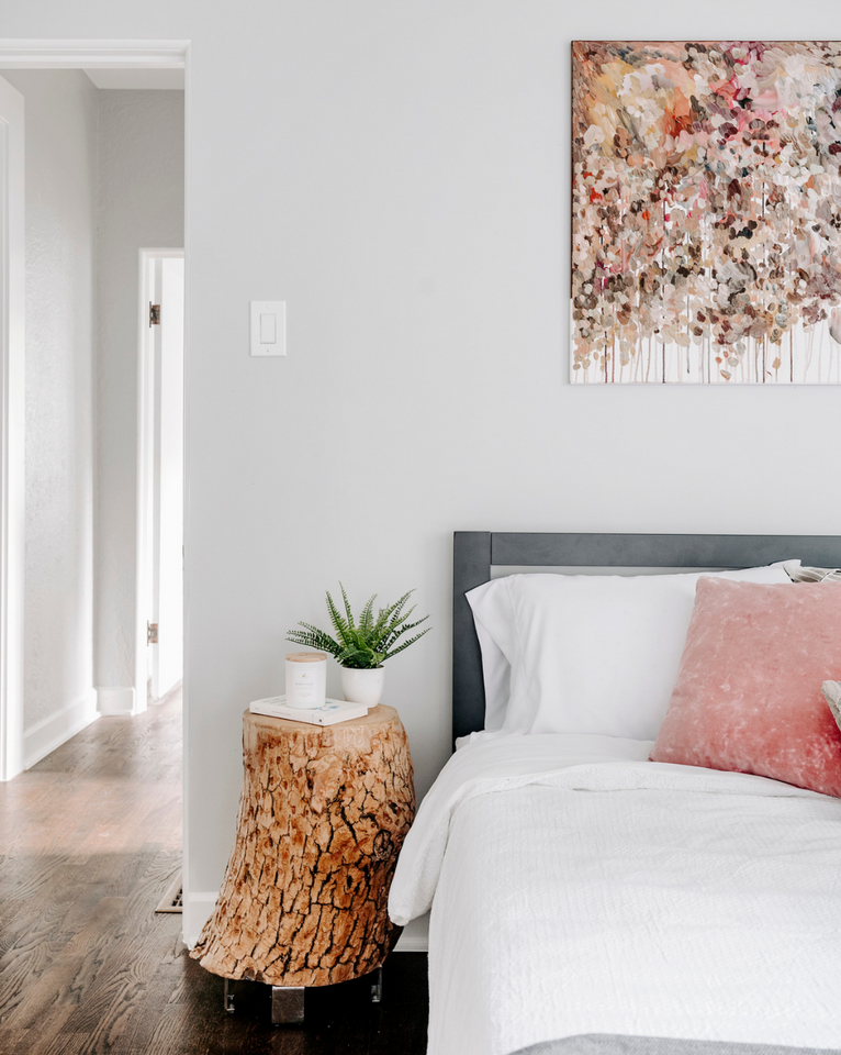 <img src="whiteandpinkbedroomwithstumpsidetable_projects.png" alt="Bedroom with white bedding, pink throw pillow, pink art, and Rogala Design stump side table">