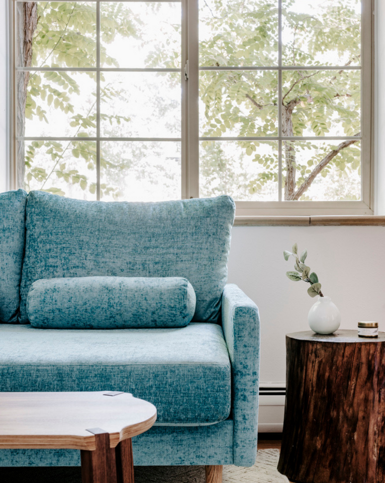 <img src="bluesofawithstumpsidetable_projects.png" alt="Blue sofa with dark stump side table">