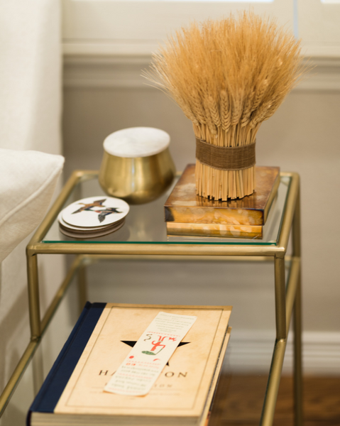 <img src="homegoods_ourshoppage.png" alt="Glass and gold Rogala Design accent table with decorative accents">
