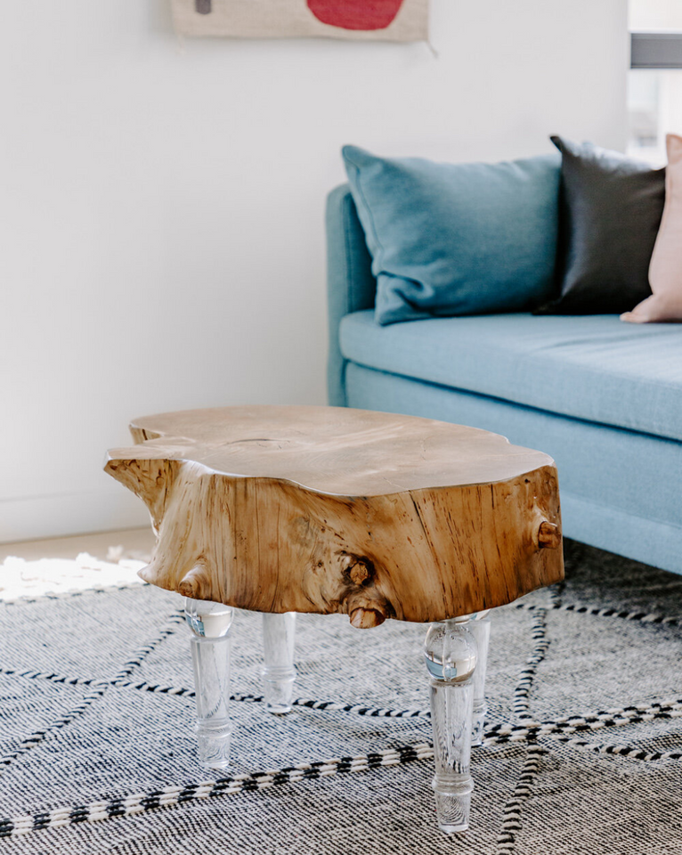 <img src="liveedgetablewithlucitelegsinfrontofbluesofa_projects.png" alt="Live edge table with lucite legs on black and white wool area rug in front of blue sofa">
