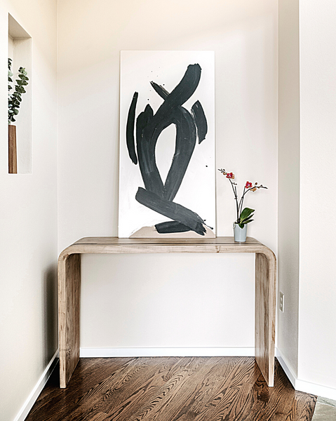 <img src="rogaladesignoriginals_designservicespage.png" alt="Rogala Design waterfall console table with black and white abstract art hung above">