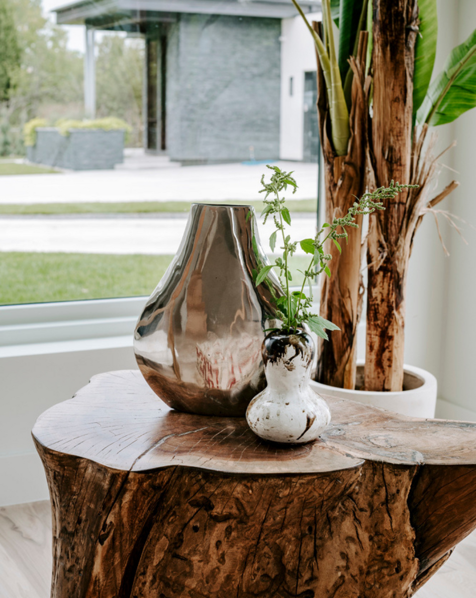 <img src="shopwithus_homepage.png" alt="Rogala Design live edge stump decorated with two vases on top">