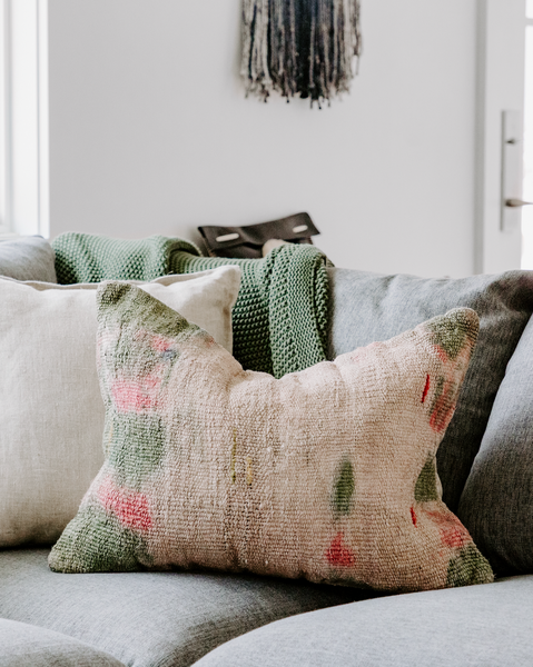 <img src="softgoods_ourshoppage.png" alt="Grey sofa with Rogala Design tie-dye throw pillows">