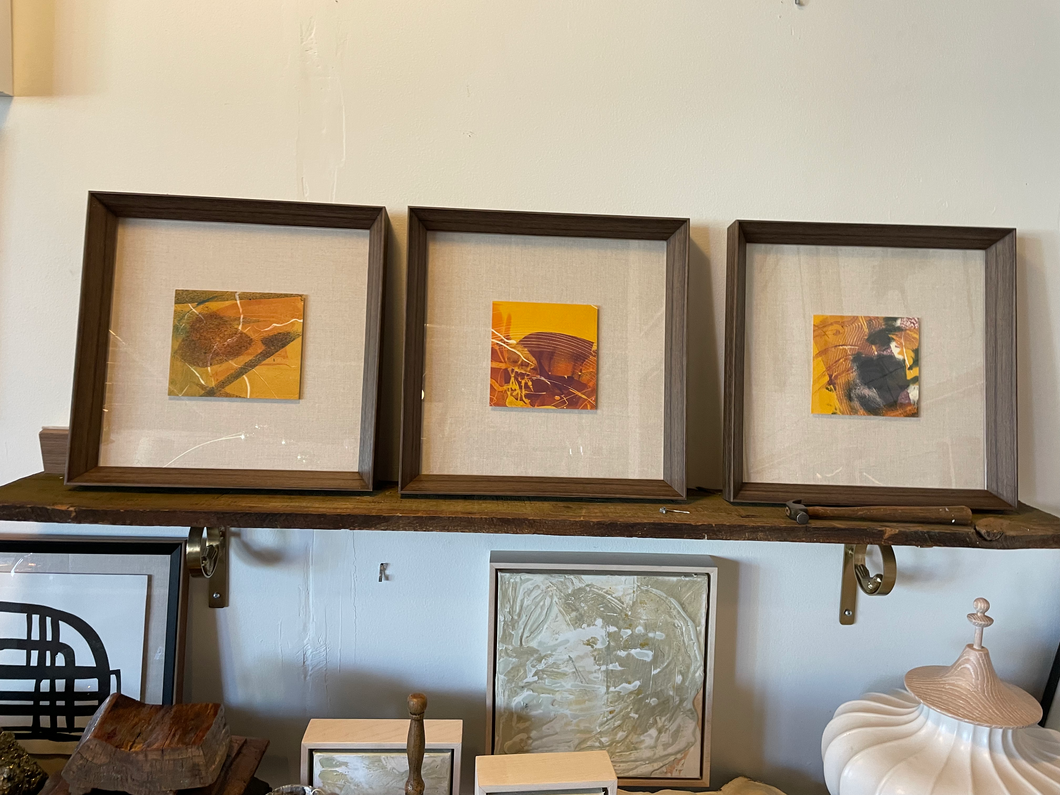 Gold + orange art in walnut knife-edge frame
